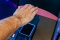 Man scanning his palm to pay in the store. Wireless payment technology