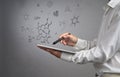 Man scientist with tablet pc and stylus or pen working with chemical formulas on gray background.