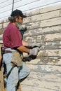 Man Scraping Paint from House Royalty Free Stock Photo