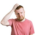 Man scratches his head in doubt Royalty Free Stock Photo