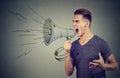 Man screaming into a megaphone making an announcement Royalty Free Stock Photo
