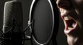 Man screaming into a microphone studio Royalty Free Stock Photo