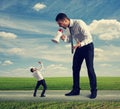 Man screaming at the small man Royalty Free Stock Photo