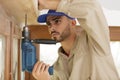 Man screwing with drill at home Royalty Free Stock Photo