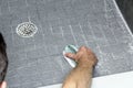 Man Scrubbing a Shower Floor