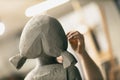 Man sculptor creates sculpt bust clay human woman sculpture. Statue craft creation workshop