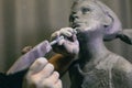 Man sculptor creates sculpt bust human woman sculpture. Statue craft creation workshop