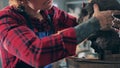 A man is sculpturing a head from clay