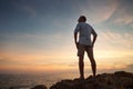 Man on the sea coast look on the sunset Royalty Free Stock Photo