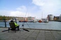 Man sea fishing in historic dock Royalty Free Stock Photo