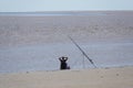 Man sea fishing by waters edge Royalty Free Stock Photo