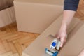 Man sealing a shipping cardboard box Royalty Free Stock Photo