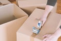 Man sealing a shipping cardboard box Royalty Free Stock Photo