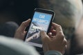 Man searching a car insurance on his smartphone