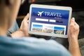 Man searching cheap flights, hotel or holiday package online
