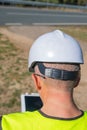 A man seen from the back piloting a drone, technology concept