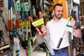 Man selecting household tools in store Royalty Free Stock Photo