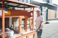 Man selling bakso by walking and pushing down the food carts Royalty Free Stock Photo