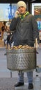 Man is selling chestnuts on the street in Milan