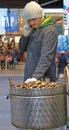 Man is selling chestnuts on the street in Milan
