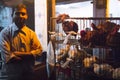 Man selling chicken in Srimangal, Bangladesh