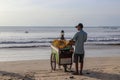 Man selling corn at Jimbaran beach in Bali, Indonesia Royalty Free Stock Photo