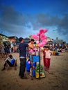 Man selling cotton candy at Juhu beach - JUHU BEACH, MUMBAI, MAHARASHTRA, INDIA - 17/05/2022 Royalty Free Stock Photo