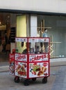A man selling crepes from a small kiosk outside a fashion store in briggate in leeds city centre