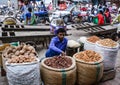 A man selling dried nuts on street in Delhi, India