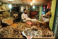 Man selling dry fish on market, India Royalty Free Stock Photo