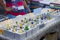 Vendor selling perfume in colorful bottles