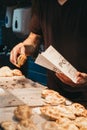 Man selling empanadas at Porteno market stall inside Borough Market, London, UK Royalty Free Stock Photo