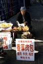 Man selling food along street