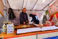 A man selling foods at market in Nikko, Japan