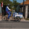 A man selling Fresh Milk in Bogor, West Java, Indonesia who is pedaling his merchandise cart