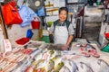 man selling frsh fish on ice at Fa Yuen street market, the market for fresh food