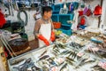 man selling frsh fish on ice at Fa Yuen street market, the market for fresh food