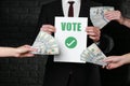 Man selling his vote on dark background. Corruption concept