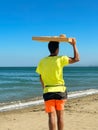 A man selling Moroccan donuts on the beach