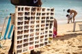 Man selling sunglasses on Porto da Barra beach