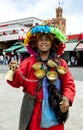 A man selling tea from a traditional vase in Djemaa el-Fna, the main square in the Marrakesh medina in Morocco.