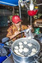 Man sells delicious dumplings at the outdoor market