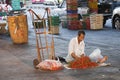 man sells fresh chili at at the street in chinatown of Bangkok