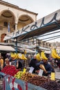 Man sells fruits using a stall at Monastiraki square in Athens Royalty Free Stock Photo