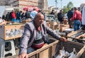 man sells live pigeons kept at cage at Pigeon Bazaar