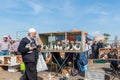 man sells live pigeons kept at cage at Pigeon Bazaar