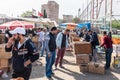 man sells live pigeons kept at cage at Pigeon Bazaar