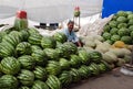 A man sells melons and watermelons Royalty Free Stock Photo