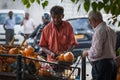 Man sells orange drinking cocoes