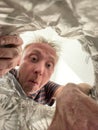 Man separating waste at home, throw litter to the bin Royalty Free Stock Photo